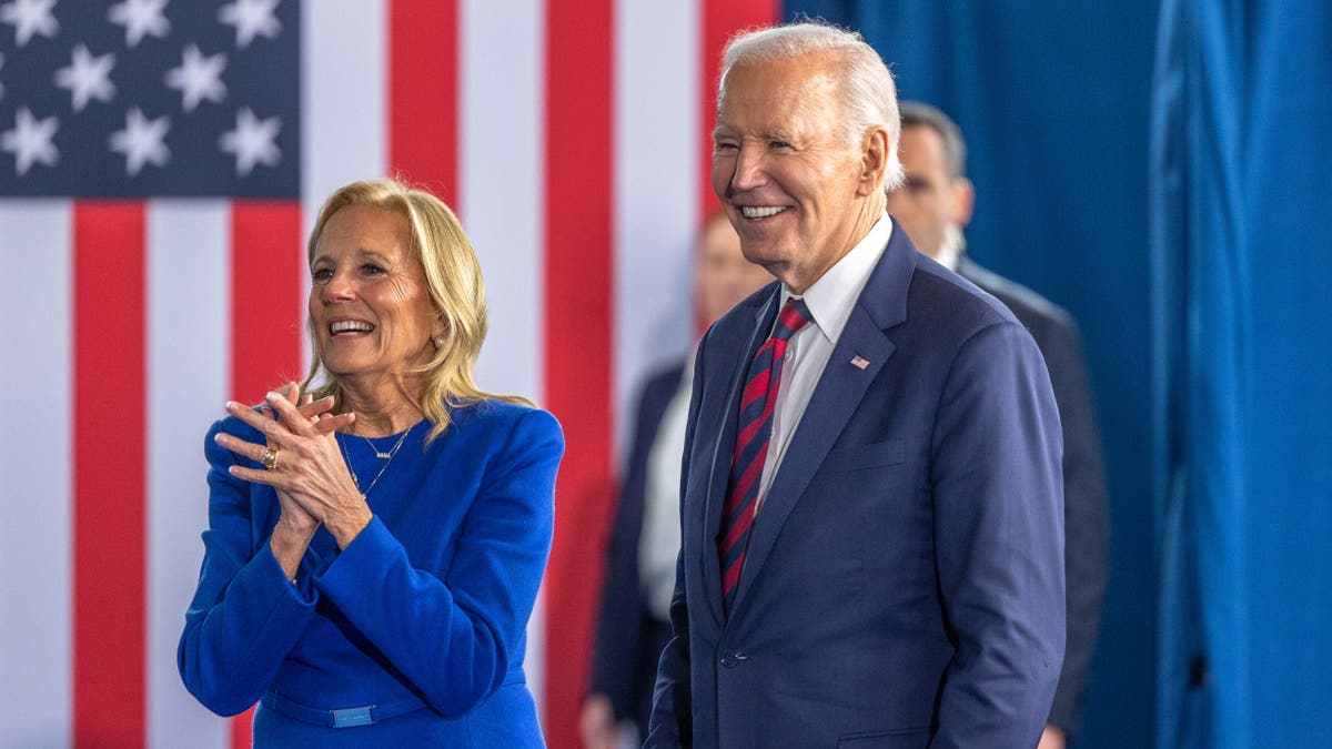 U.S. President Joe Biden and first lady Jill Biden exiting stage at International African-American Museum