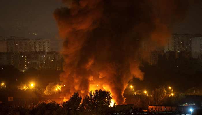 Fire and smoke rise in the city during a Russian missile and drone strike, amid Russias attack on Ukraine, in Kyiv, Ukraine October 7, 2026.— Reuters