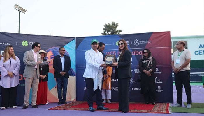 Junaid Family Foundation Chairman and Trustee Ansir Junaid presents souvenir to United States Charge dAffaires Natalie Baker at the closing ceremony of the Womens World Tennis W15 Futures Tournament in Islamabad, October 17, 2026. — Reporter