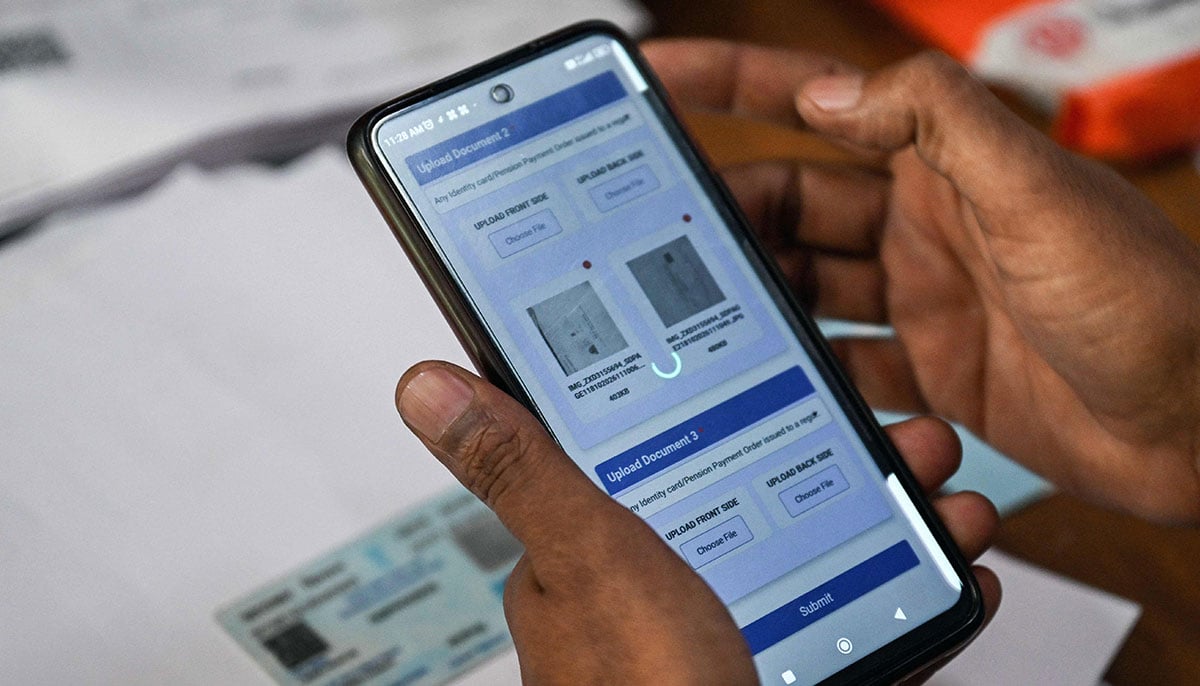 An enumerator uploads documents of an applicant registering for the Draft Electoral Roll 2026 as part of the Election Commission of Indias Special Intensive Revision (SIR), at a voter verification camp in New Delhi on October 18, 2026. — AFP