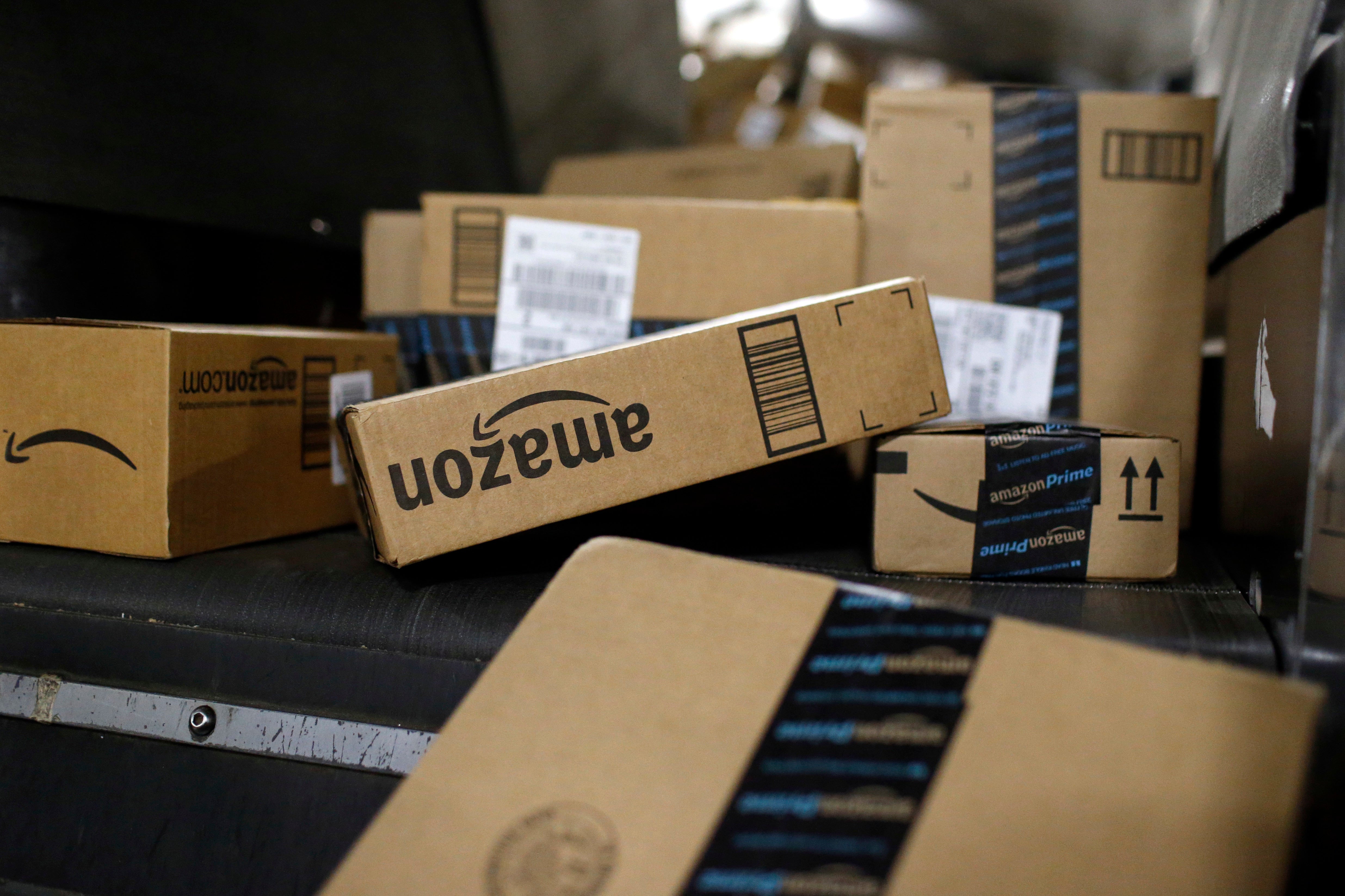 Packages in Amazon boxes move along a conveyor belt at the UPS Worldport hub in Louisville