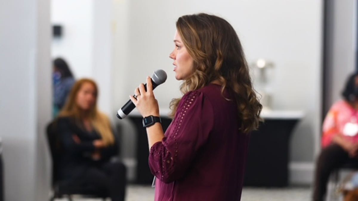 Kara Robinson Chamberlain giving a speech.