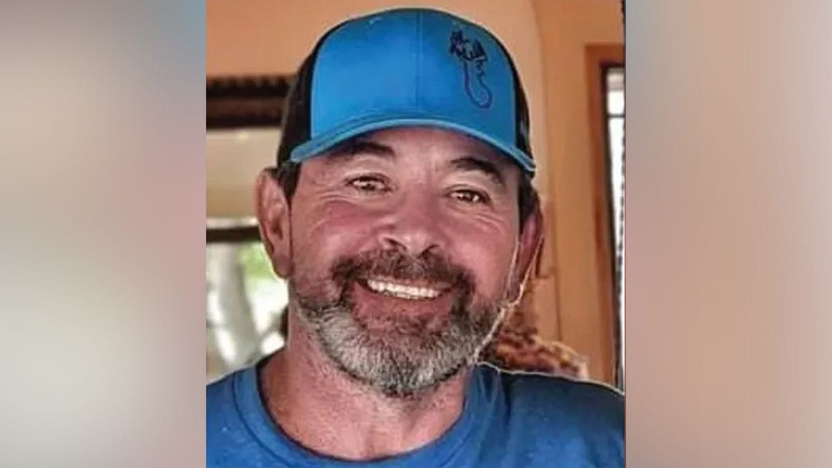 Chad Mullen smiles while wearing a blue baseball cap and blue shirt. He was murdered by his girlfriend, Caylen Deller, in September 2024.