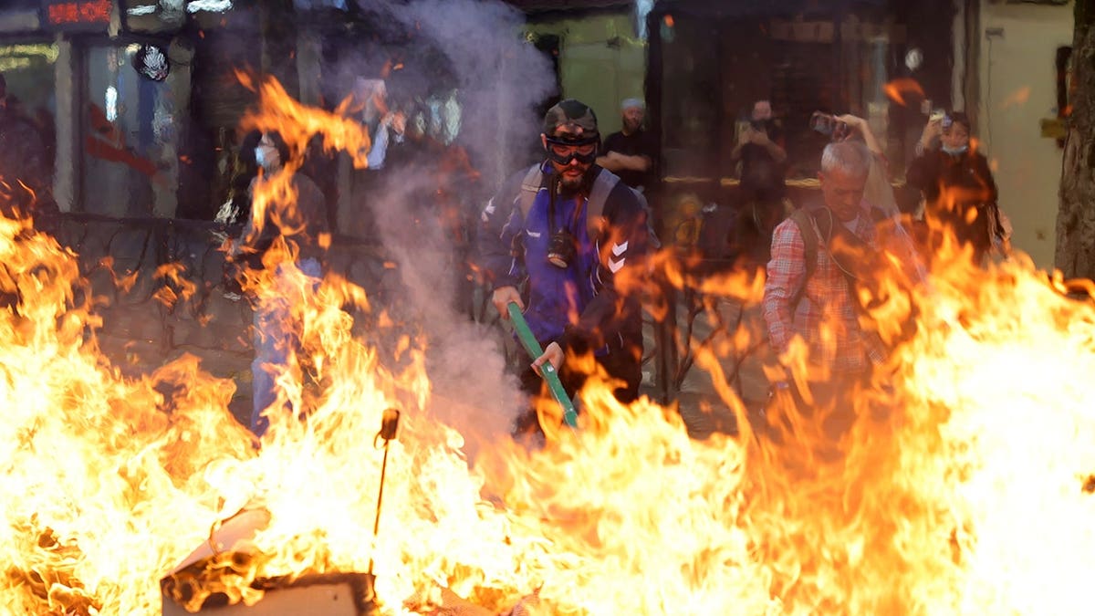 Protesters set fire to a barricade during clashes near the Education Ministry in Tirana, Albania.
