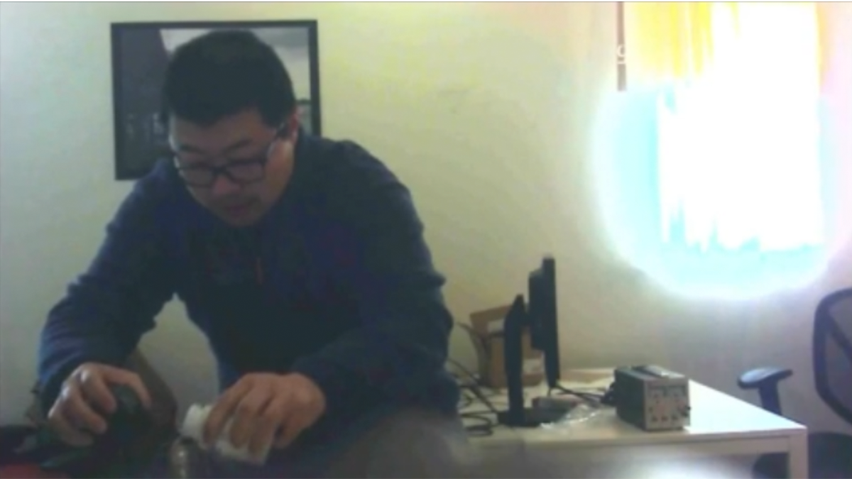 Man pouring a substance into a water bottle