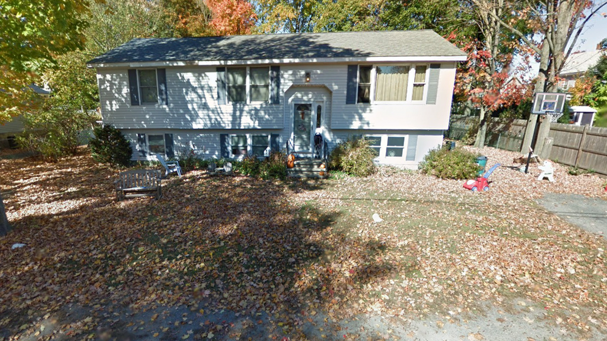 A white New England house in the fall