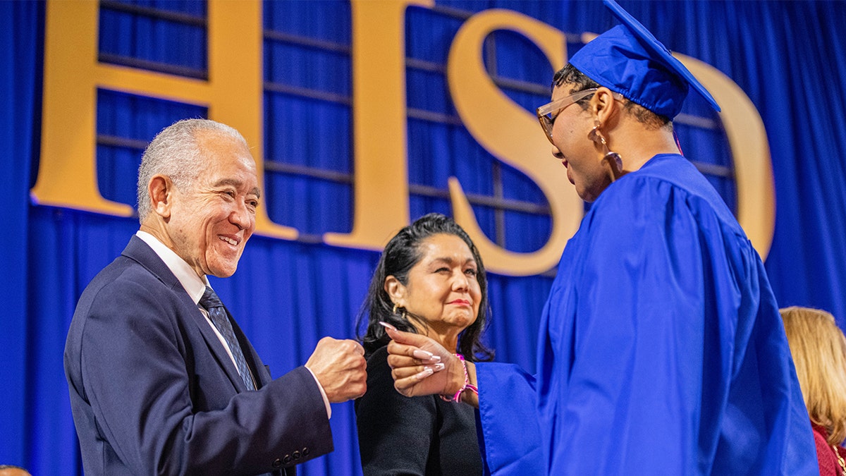 Student graduating at Houston Independent School District ceremony.