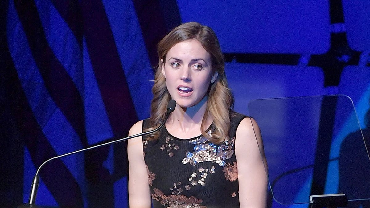Kyle Kennedy Kerr speaks onstage during an awards ceremony.