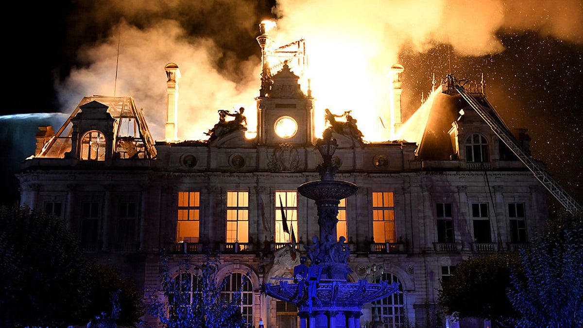 This photograph shows a fire burning and destroying the city hall after a group of individuals forced entry into the building during ongoing protest action against the "high cost of living", in Limoges, central France on October 17, 2026 as part of a nationwide call for mobilisation bringing together various groups expressing their anger: former "Yellow Vest", secondary school and university students, climate activists and even farmers. After weeks of student protests, France faces broader, nationwide demonstrations on October 17, 2026 over the cost of living, setting up a potentially fraught six months heading into a presidential election. A police source told AFP that authorities estimated nearly 200,000 people could take part, with 40,000 in Paris.
