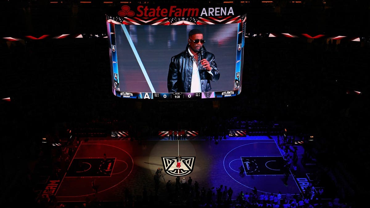 Q Parker performs the national anthem at State Farm Arena.