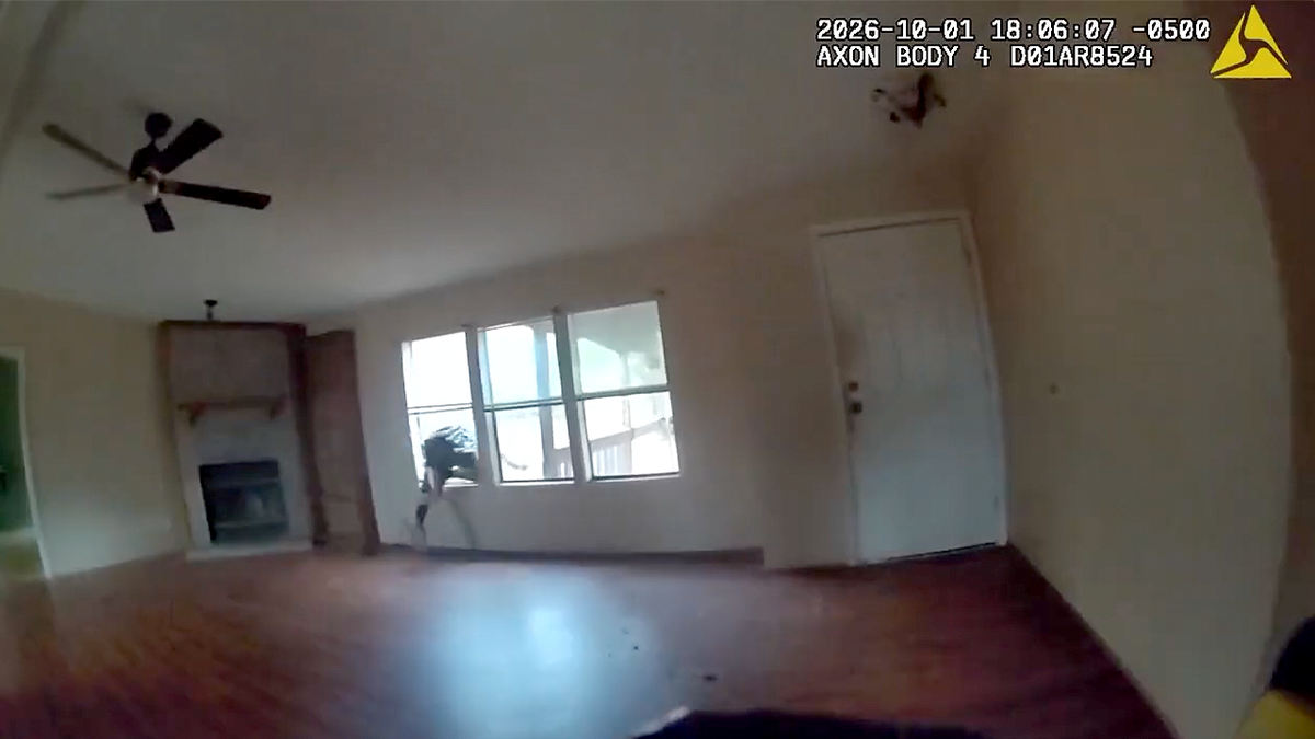 Rayven Lee Wooten dives headfirst through a living room window in body camera video
