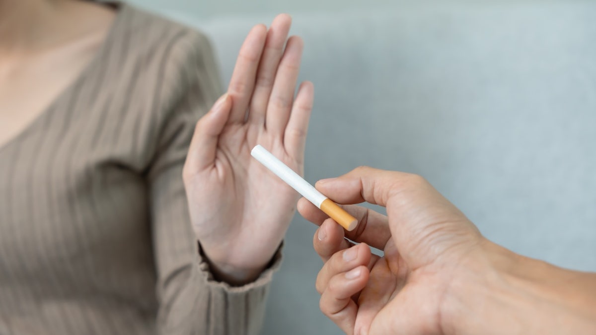woman refuses a cigarette
