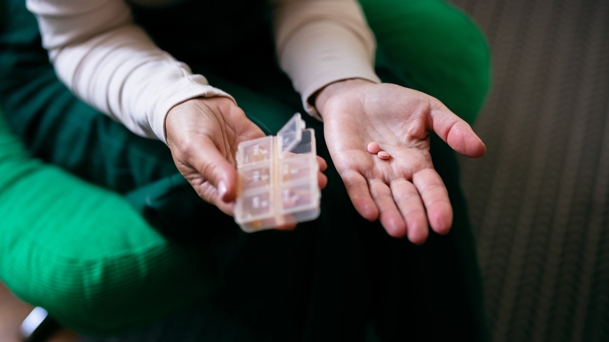 Woman taking pills